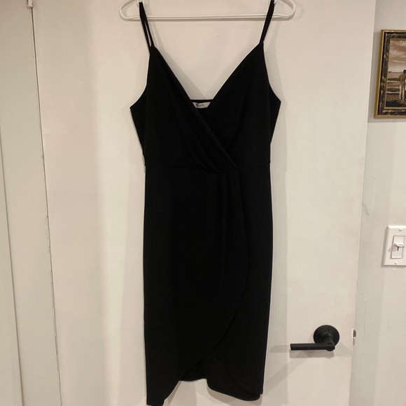 Ricki's Dresses & Skirts - LBD - tulip skirt, deep v neck and midi length